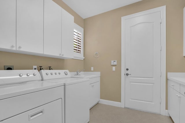 8732 Bally Bunion Rd, Port Saint Lucie, FL 34986 - laundry room with cabinet space, washing machine and clothes dryer, and light tile patterned floors