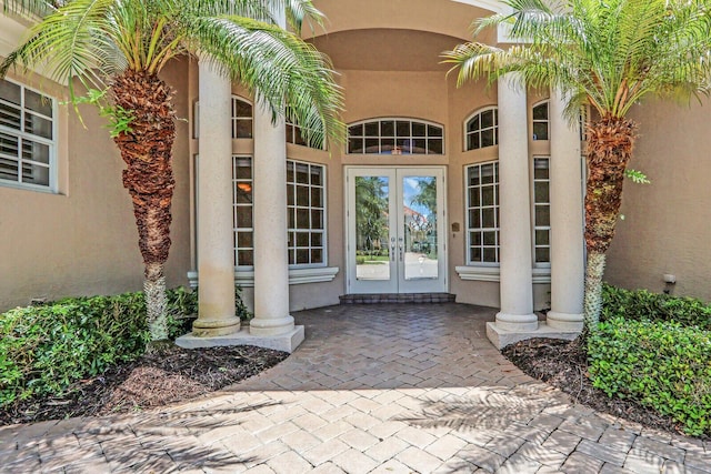 8732 Bally Bunion Rd, Port Saint Lucie, FL 34986 - doorway to property featuring french doors and stucco siding