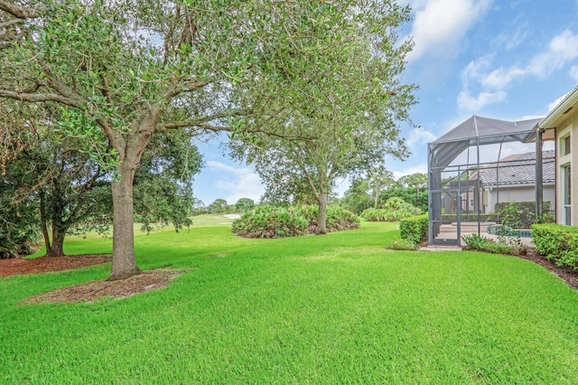 8732 Bally Bunion Rd, Port Saint Lucie, FL 34986 - view of green lawn featuring a lanai
