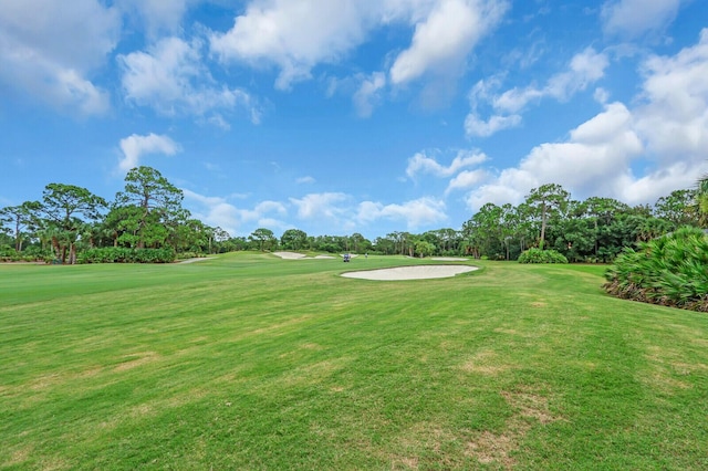 8732 Bally Bunion Rd, Port Saint Lucie, FL 34986 - view of home's community with golf course view, view of wooded area, and a yard
