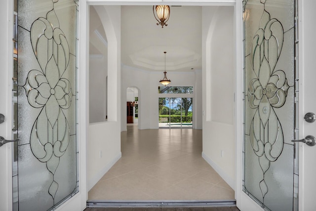 8732 Bally Bunion Rd, Port Saint Lucie, FL 34986 - tiled entryway with arched walkways and a raised ceiling