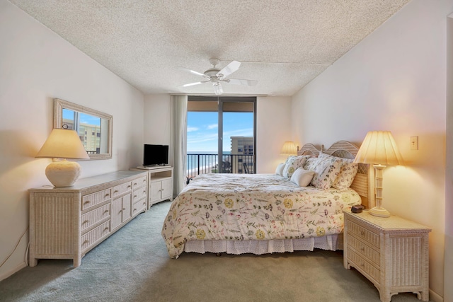 200 Ocean Trail Way Unit 1009, Jupiter, FL 33477 - bedroom with access to exterior, light carpet, a textured ceiling, a ceiling fan, and a wall of windows