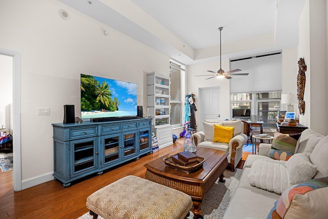 550 Okeechobee Blvd Unit 114, West Palm Beach, FL 33401 - living area featuring wood finished floors, a ceiling fan, and a raised ceiling