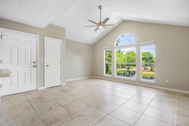 1000 Crystal Way Unit J, Delray Beach, FL 33444 - unfurnished living room with a ceiling fan, light tile patterned floors, a textured ceiling, and high vaulted ceiling