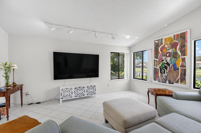 3010 NW 12th St Unit D, Delray Beach, FL 33445 - tiled living room featuring track lighting and a textured ceiling
