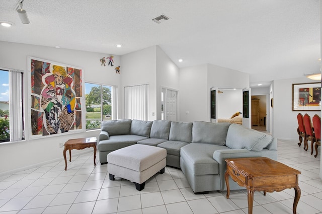 3010 NW 12th St Unit D, Delray Beach, FL 33445 - living area with a textured ceiling, light tile patterned floors, and recessed lighting