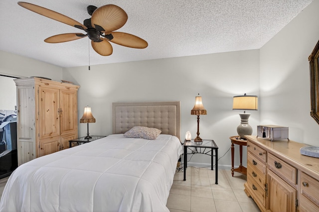 3010 NW 12th St Unit D, Delray Beach, FL 33445 - bedroom with light tile patterned floors, ceiling fan, and a textured ceiling