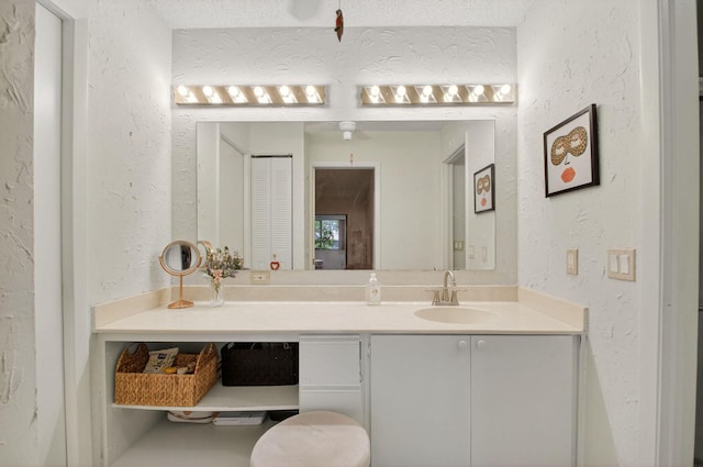 3010 NW 12th St Unit D, Delray Beach, FL 33445 - bathroom with vanity and a textured wall