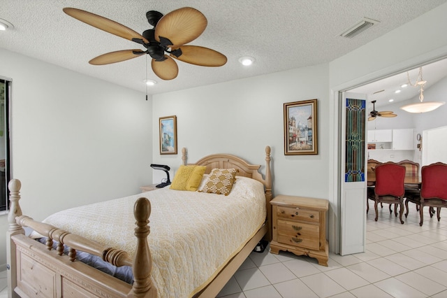 3010 NW 12th St Unit D, Delray Beach, FL 33445 - bedroom featuring light tile patterned floors, a textured ceiling, recessed lighting, and a ceiling fan
