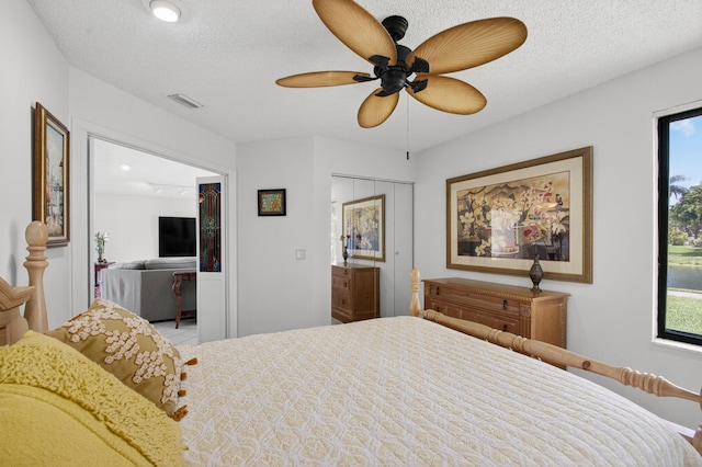 3010 NW 12th St Unit D, Delray Beach, FL 33445 - bedroom featuring ceiling fan and a textured ceiling
