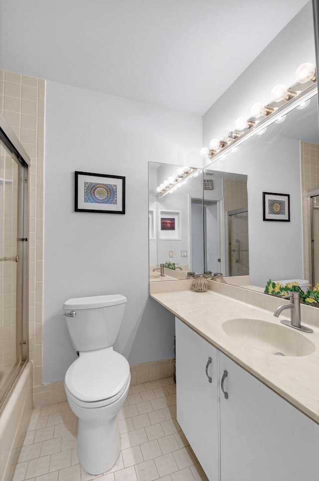 3010 NW 12th St Unit D, Delray Beach, FL 33445 - full bath featuring tile patterned flooring, vanity, and bath / shower combo with glass door
