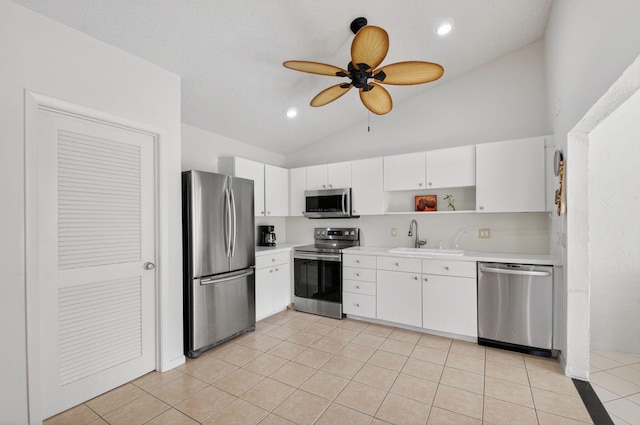 3010 NW 12th St Unit D, Delray Beach, FL 33445 - kitchen with stainless steel appliances, lofted ceiling, open shelves, light countertops, and ceiling fan