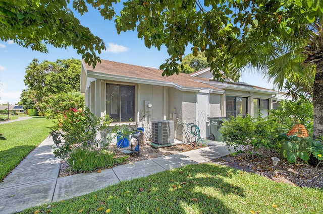 3010 NW 12th St Unit D, Delray Beach, FL 33445 - single story home with stucco siding, a front yard, and a shingled roof