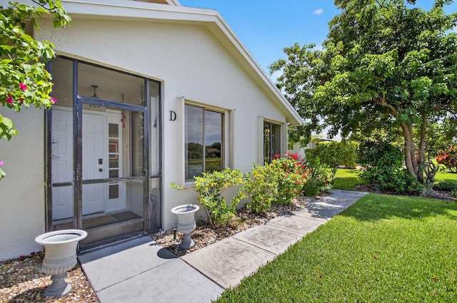3010 NW 12th St Unit D, Delray Beach, FL 33445 - entrance to property featuring stucco siding and a lawn
