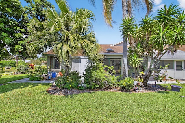 3010 NW 12th St Unit D, Delray Beach, FL 33445 - view of front of property with a front yard and a shingled roof