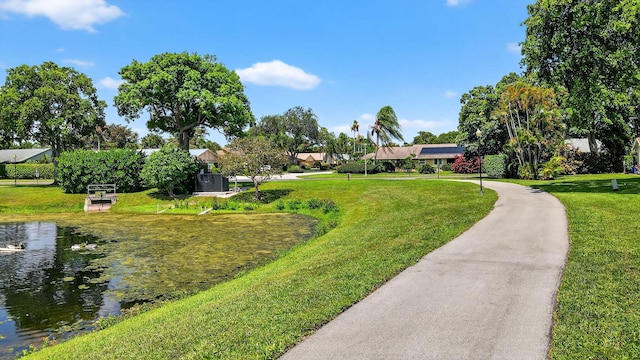 3010 NW 12th St Unit D, Delray Beach, FL 33445 - surrounding community featuring a water view and a yard