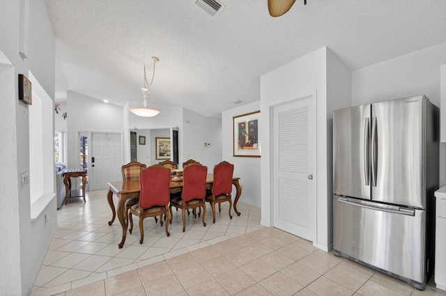 3010 NW 12th St Unit D, Delray Beach, FL 33445 - dining area with light tile patterned floors, a textured ceiling, ceiling fan, and lofted ceiling