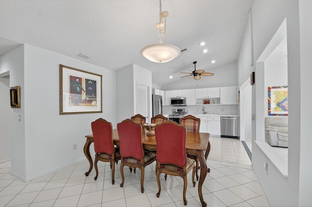 3010 NW 12th St Unit D, Delray Beach, FL 33445 - dining room with a ceiling fan, lofted ceiling, and light tile patterned floors