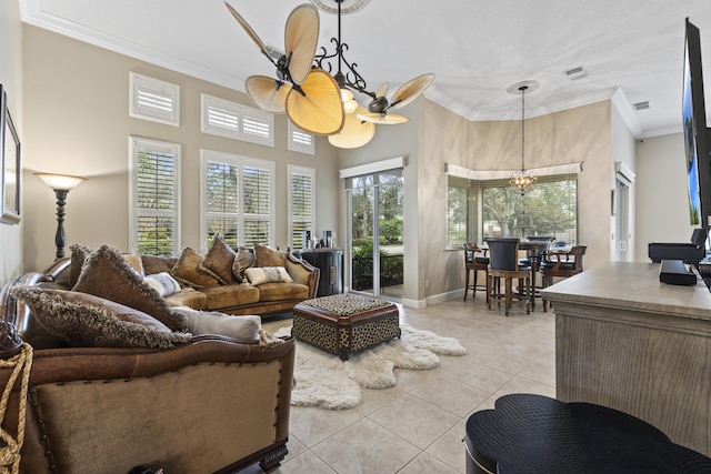 801 SW Classico Ct, Port Saint Lucie, FL 34986 - living area with a chandelier, ornamental molding, light tile patterned floors, and a high ceiling