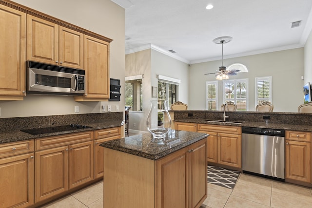 801 SW Classico Ct, Port Saint Lucie, FL 34986 - kitchen with appliances with stainless steel finishes, light tile patterned floors, a ceiling fan, ornamental molding, and dark stone counters