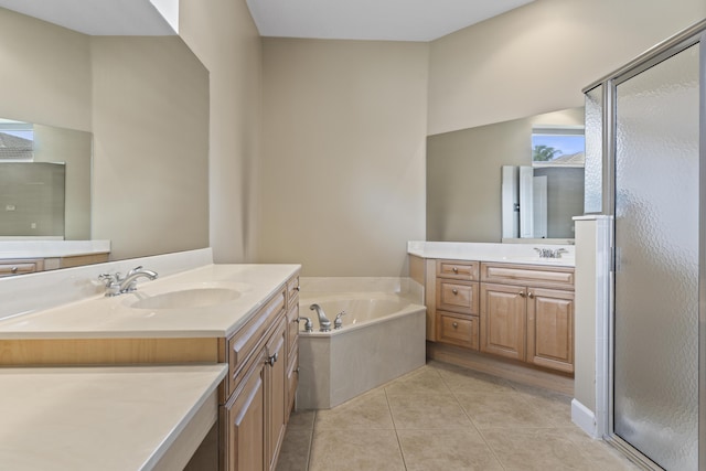 801 SW Classico Ct, Port Saint Lucie, FL 34986 - bathroom with two vanities, a stall shower, a bath, and tile patterned floors