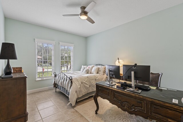 801 SW Classico Ct, Port Saint Lucie, FL 34986 - bedroom with an office area, light tile patterned floors, and a ceiling fan