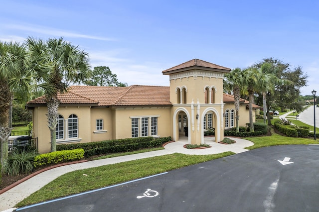 801 SW Classico Ct, Port Saint Lucie, FL 34986 - view of front of house with stucco siding, a tiled roof, and a front yard