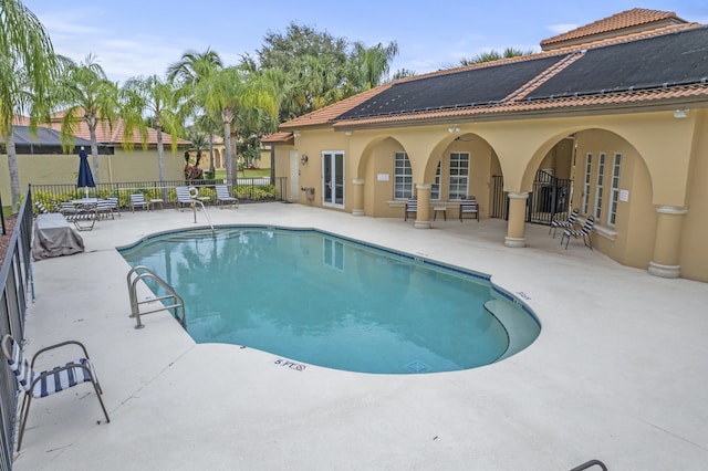 801 SW Classico Ct, Port Saint Lucie, FL 34986 - community pool featuring a patio area and french doors