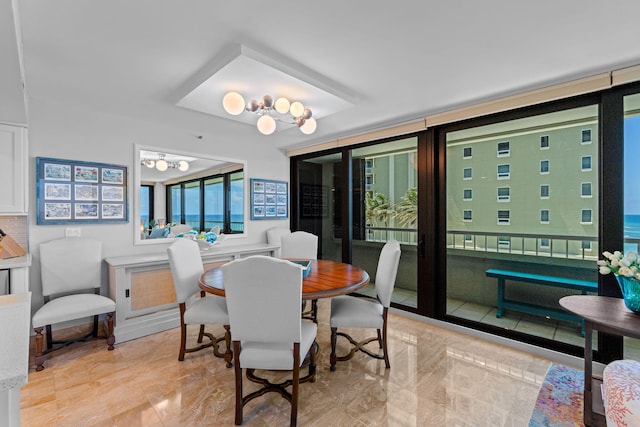 5280 N Ocean Dr Unit 3B, Singer Island, FL 33404 - dining area with light marble finish floors