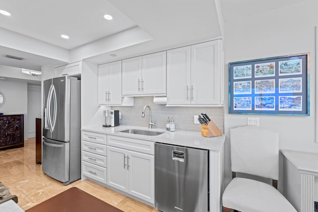 5280 N Ocean Dr Unit 3B, Singer Island, FL 33404 - kitchen featuring appliances with stainless steel finishes, white cabinets, decorative backsplash, and recessed lighting