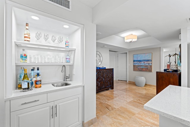 5280 N Ocean Dr Unit 3B, Singer Island, FL 33404 - indoor wet bar featuring a tray ceiling