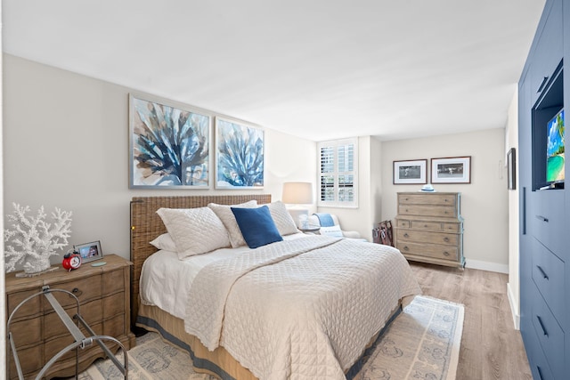 5280 N Ocean Dr Unit 3B, Singer Island, FL 33404 - bedroom featuring light wood-style flooring and baseboards