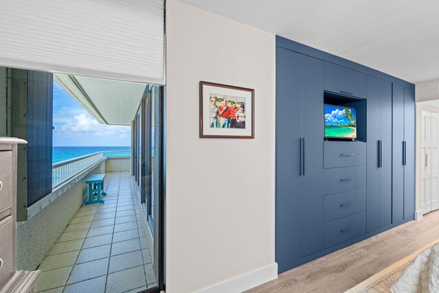 5280 N Ocean Dr Unit 3B, Singer Island, FL 33404 - hall featuring a water view and light wood-type flooring