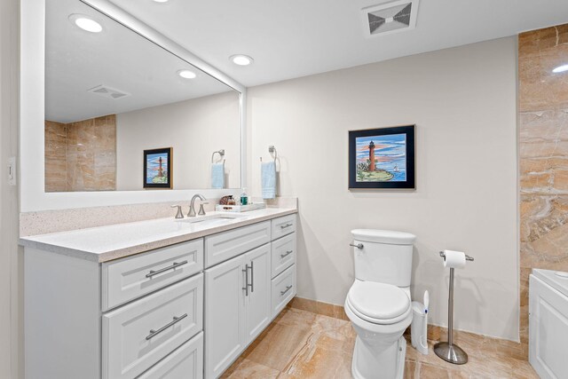 5280 N Ocean Dr Unit 3B, Singer Island, FL 33404 - bathroom with vanity and recessed lighting