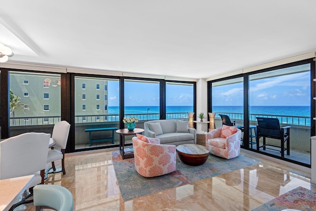 5280 N Ocean Dr Unit 3B, Singer Island, FL 33404 - living room with a water view, marble tiled flooring, and expansive windows