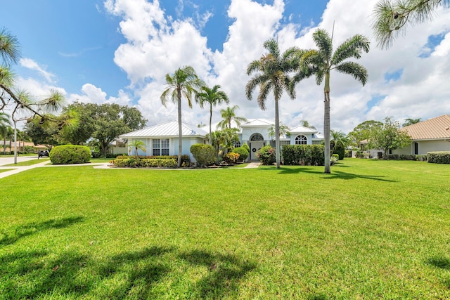 6025 Fountain Palm Dr, Jupiter, FL 33458 - view of front of house with a front yard