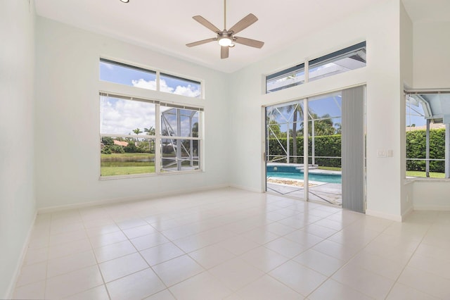 6025 Fountain Palm Dr, Jupiter, FL 33458 - unfurnished room with ceiling fan, plenty of natural light, and tile patterned flooring