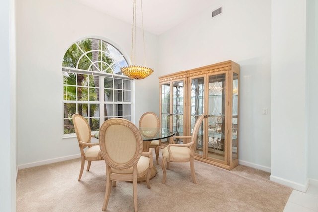 6025 Fountain Palm Dr, Jupiter, FL 33458 - dining room with a towering ceiling and carpet flooring