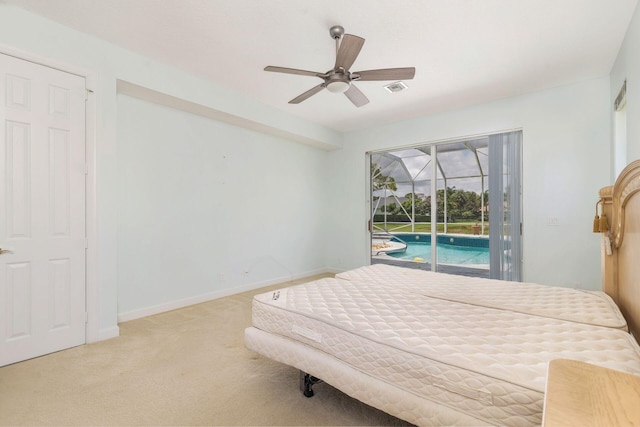6025 Fountain Palm Dr, Jupiter, FL 33458 - carpeted bedroom with access to exterior, a sunroom, and a ceiling fan