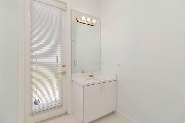 6025 Fountain Palm Dr, Jupiter, FL 33458 - bathroom with vanity and tile patterned floors