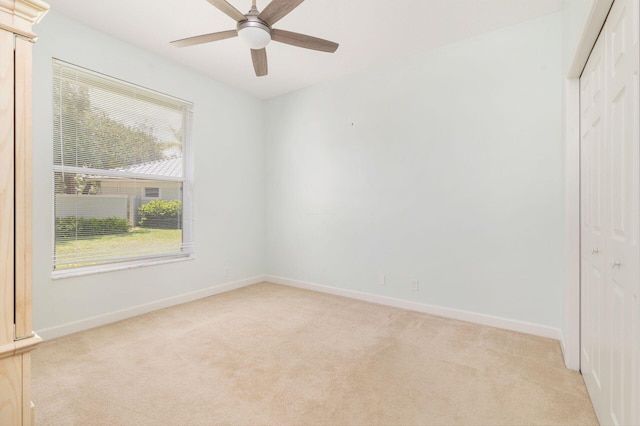 6025 Fountain Palm Dr, Jupiter, FL 33458 - unfurnished bedroom featuring a closet, light carpet, and ceiling fan