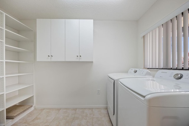 15378 Lakes Of Delray Blvd Unit 15, Delray Beach, FL 33484 - laundry room with washing machine and dryer, light tile patterned flooring, and cabinet space