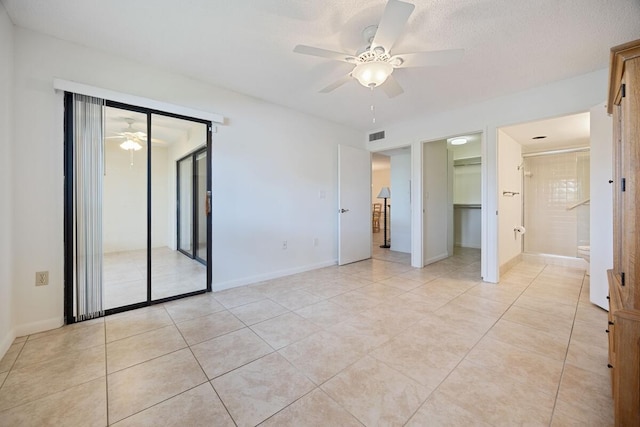 15378 Lakes Of Delray Blvd Unit 15, Delray Beach, FL 33484 - unfurnished bedroom with light tile patterned floors, a ceiling fan, a closet, and ensuite bath