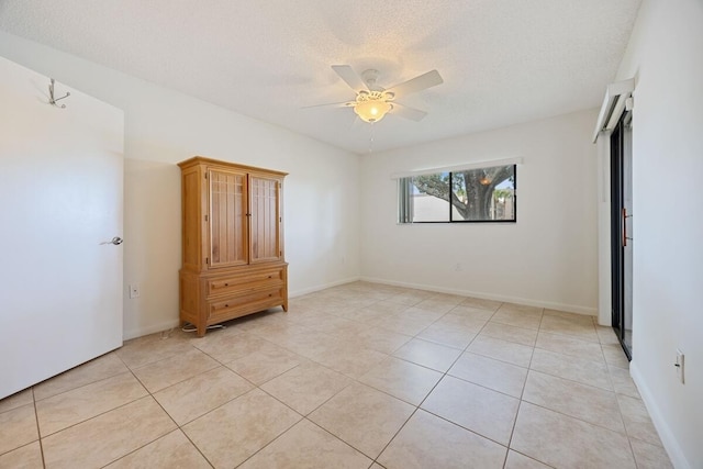 15378 Lakes Of Delray Blvd Unit 15, Delray Beach, FL 33484 - unfurnished bedroom with light tile patterned flooring, ceiling fan, and a textured ceiling
