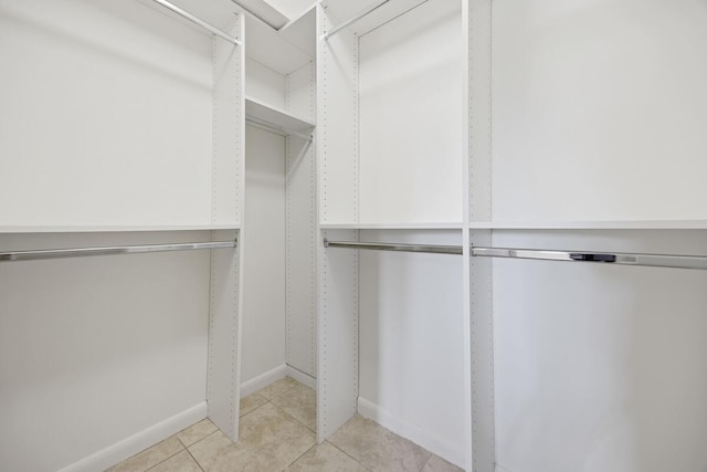 15378 Lakes Of Delray Blvd Unit 15, Delray Beach, FL 33484 - walk in closet featuring light tile patterned flooring