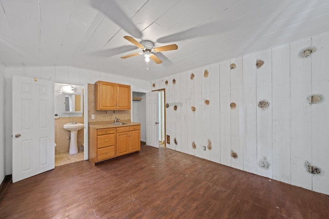 4621 N Ocean Blvd, Boynton Beach, FL 33435 - interior space featuring dark wood-style flooring, ensuite bathroom, vaulted ceiling, a ceiling fan, and wooden walls