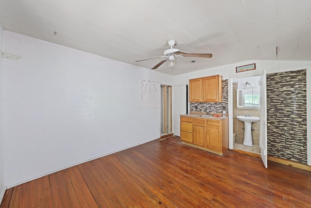 4621 N Ocean Blvd, Boynton Beach, FL 33435 - kitchen with dark wood-type flooring, a ceiling fan, and light countertops