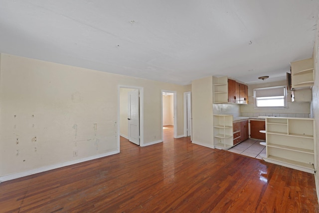 4621 N Ocean Blvd, Boynton Beach, FL 33435 - kitchen with open shelves, wood finished floors, and light countertops