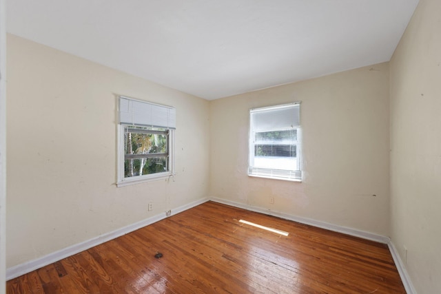 4621 N Ocean Blvd, Boynton Beach, FL 33435 - unfurnished room with healthy amount of natural light and wood-type flooring
