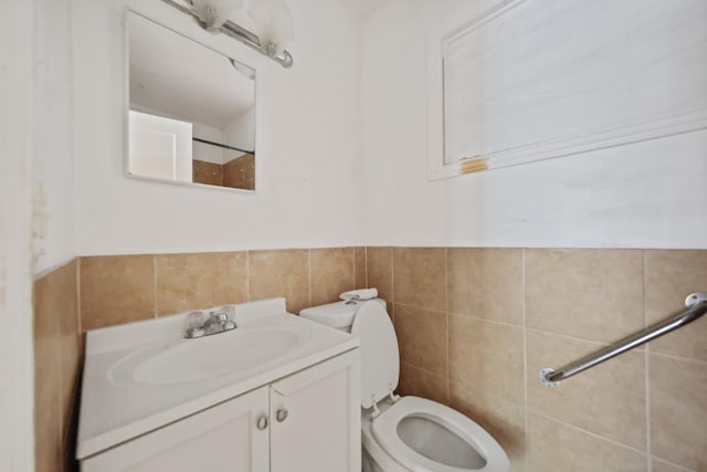4621 N Ocean Blvd, Boynton Beach, FL 33435 - bathroom featuring tile walls and vanity
